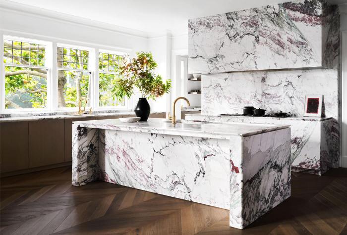 Luxury kitchen design with waterfall island